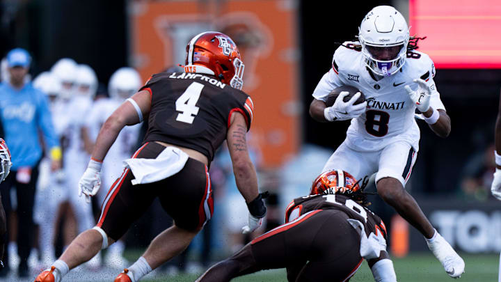 Bowling Green Falcons cornerback JoJo Johnson (10) tackles Cincinnati Bearcats wide receiver Noah Jennings (8) in the fourth quarter of the NCAA football game between the Cincinnati Bearcats and Bowling Green Falcons at Nippert Stadium in Cincinnati on Sept. 6, 2025. Bowling Green Falcons cornerback JoJo Johnson (10) tackles Cincinnati Bearcats wide receiver Noah Jennings (8) in the fourth quarter of the NCAA football game between the Cincinnati Bearcats and Bowling Green Falcons at Nippert Stadium in Cincinnati on Sept. 6, 2025.