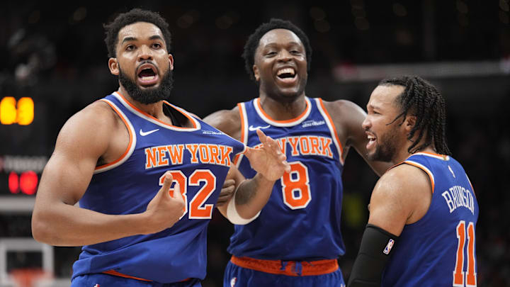 Dec 9, 2024; Toronto, Ontario, CAN; New York  Knicks guard Jalen Brunson (11) and forward OG Anunoby (8) react after a three point basket by center Karl-Anthony Towns (32) to clinch a win over the Toronto Raptors during the second half at Scotiabank Arena. Mandatory Credit: John E. Sokolowski-Imagn Images