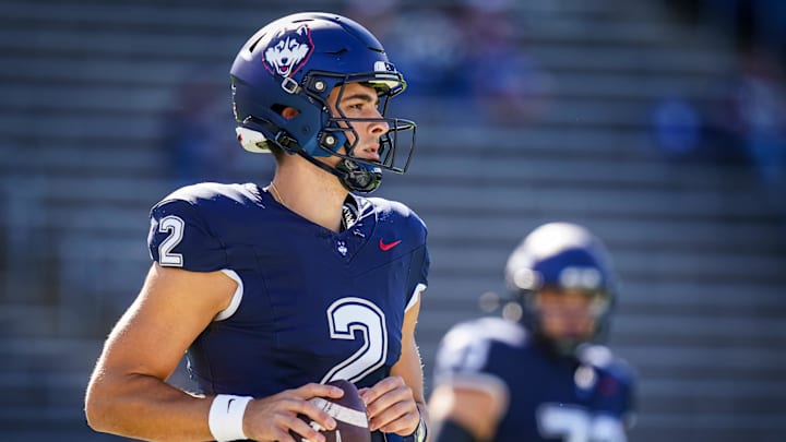 Sep 20, 2025; East Hartford, Connecticut, USA; Connecticut Huskies quarterback Joe Fagnano (2) warms up before the start of the game against the Ball State Cardinals at Pratt & Whitney Stadium at Rentschler Field. Mandatory Credit: David Butler II-Imagn Images