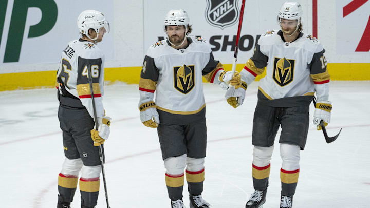 Jan 25, 2026; Ottawa, Ontario, CAN; Vegas Golden Knights defenseman Rasmus Anderssson (4 - center) celebrates with right wing Jonas Rondbjerg (46) and defenseman Noah Hanifin (15) his goal scored in the third period against the Ottawa Senators at the Canadian Tire Centre. Mandatory Credit: Marc DesRosiers-IMAGN Images Jan 25, 2026; Ottawa, Ontario, CAN; Vegas Golden Knights defenseman Rasmus Anderssson (4 - center) celebrates with right wing Jonas Rondbjerg (46) and defenseman Noah Hanifin (15) his goal scored in the third period against the Ottawa Senators at the Canadian Tire Centre. Mandatory Credit: Marc DesRosiers-IMAGN Images