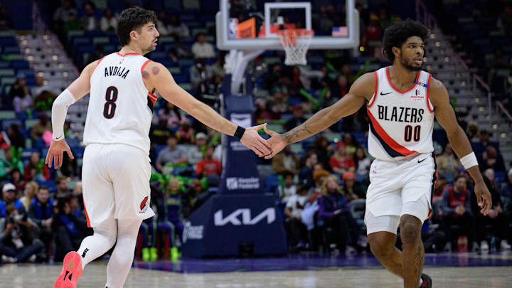 Jan 8, 2025; New Orleans, Louisiana, USA; Portland Trail Blazers forward Deni Avdija (8) and Portland Trail Blazers guard Scoot Henderson (00) celebrate during the second half against the New Orleans Pelicans at Smoothie King Center. Mandatory Credit: Matthew Hinton-Imagn Images