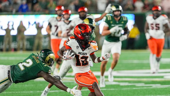 Oct 3, 2026; Fort Collins, Colorado, USA; Oregon State Beavers wide receiver Jesse Legree (12) avoids a tackle by Colorado State Rams linebacker Oumar Diomande (2) in the second half at Sonny Lubick Field at Canvas Stadium. Mandatory Credit: Andrew Rydland-Imagn Images Oct 3, 2026; Fort Collins, Colorado, USA; Oregon State Beavers wide receiver Jesse Legree (12) avoids a tackle by Colorado State Rams linebacker Oumar Diomande (2) in the second half at Sonny Lubick Field at Canvas Stadium. Mandatory Credit: Andrew Rydland-Imagn Images