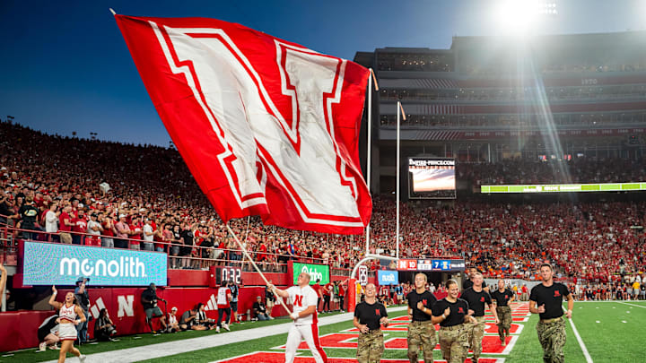 Sep 20, 2024; Lincoln, Nebraska, USA; A Nebraska Cornhuskers flag is waved after a touchdown against the Illinois Fighting Illini during the first quarter at Memorial Stadium.