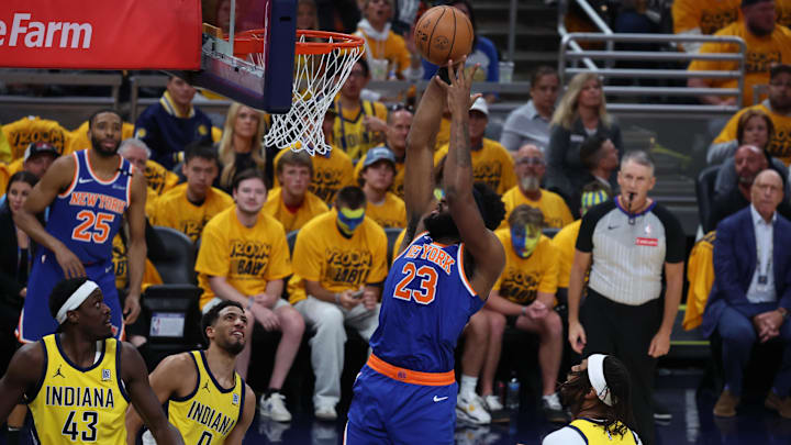 New York Knicks center Mitchell Robinson shoots a layup over Indiana Pacers center Myles Turner. Mandatory Credit: Trevor Ruszkowski-Imagn Images