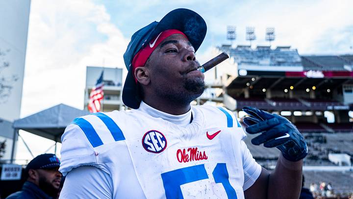 Ole Miss defensive lineman Zxavian Harris smokes a cigar after a college football game between Mississippi State and Ole Miss Ole Miss defensive lineman Zxavian Harris smokes a cigar after a college football game between Mississippi State and Ole Miss