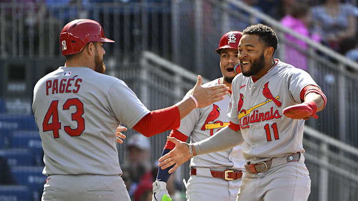 May 10, 2025; Washington, District of Columbia, USA; St. Louis Cardinals center fielder Victor Scott II (11) celebrates with catcher Pedro Pages (43) after both scored against the Washington Nationals during the second inning at Nationals Park. Mandatory Credit: Brad Mills-Imagn Images