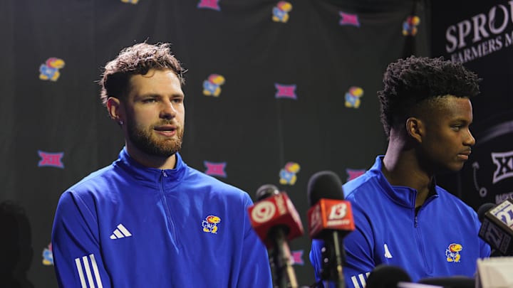 Oct 23, 2024; Kansas City, MO, USA; Kansas Jayhawks center Hunter Dickinson (1) and forward KJ Adams Jr. (24) talk to media during the Big 12 Men’s Basketball Media Day at T-Mobile Center. Mandatory Credit: Jay Biggerstaff-Imagn Images