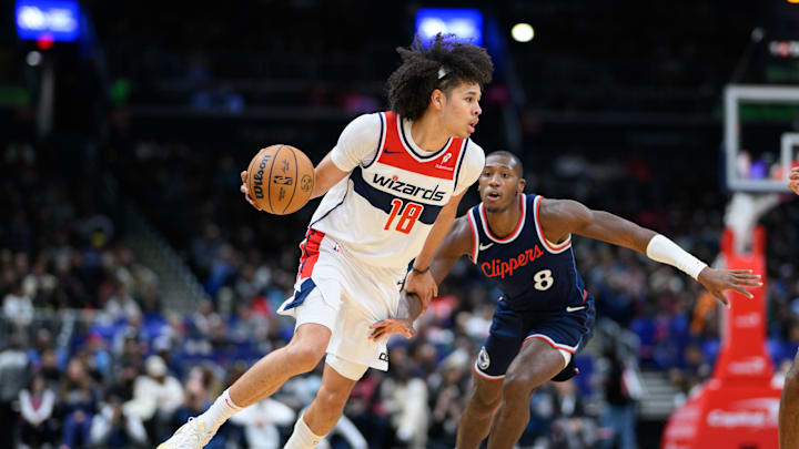 Nov 27, 2024; Washington, District of Columbia, USA; Washington Wizards forward Kyshawn George (18) drives to the basket against LA Clippers guard Kris Dunn (8) during the second quarter at Capital One Arena. Mandatory Credit: Reggie Hildred-Imagn Images Nov 27, 2024; Washington, District of Columbia, USA; Washington Wizards forward Kyshawn George (18) drives to the basket against LA Clippers guard Kris Dunn (8) during the second quarter at Capital One Arena. Mandatory Credit: Reggie Hildred-Imagn Images
