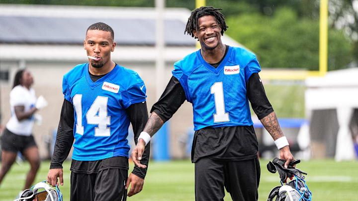 Detroit Lions wide receiver Amon-Ra St. Brown (14), left, shares a laughter with wide receiver Jameson Williams (1) as they walk off the field after practice during training camp at Meijer Performance Center in Allen Park on Sunday, July 20, 2025.