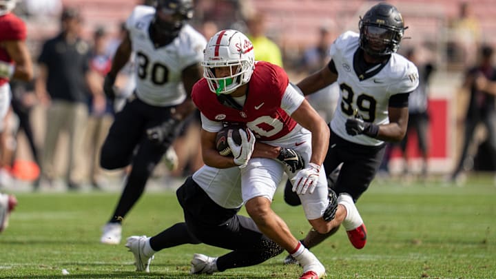 Oct 26, 2024; Stanford, California, USA; Stanford Cardinal wide receiver Emmett Mosley V (10) is tackled by Wake Forest Demon Deacons defensive back Evan Slocum (7) during the second quarter at Stanford Stadium. Mandatory Credit: Neville E. Guard-Imagn Images Oct 26, 2024; Stanford, California, USA; Stanford Cardinal wide receiver Emmett Mosley V (10) is tackled by Wake Forest Demon Deacons defensive back Evan Slocum (7) during the second quarter at Stanford Stadium. Mandatory Credit: Neville E. Guard-Imagn Images