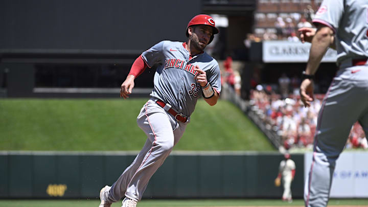 Jun 29, 2024; St. Louis, Missouri, USA; Cincinnati Reds catcher Austin Wynns (35) rounds third base to score off a ground rule double from second baseman Jonathan India (6) against the St. Louis Cardinals during the third inning at Busch Stadium. Mandatory Credit: Jeff Le-Imagn Images