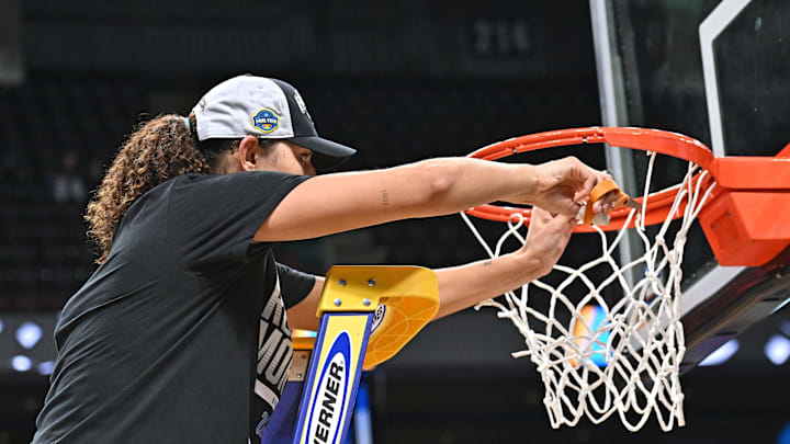 Mar 30, 2025; Spokane, WA, USA; UCLA Bruins center Lauren Betts (51) cuts the net after an Elite 8 NCAA Tournament basketball game against the LSU Lady Tigers at Spokane Arena. Mandatory Credit: James Snook-Imagn Images