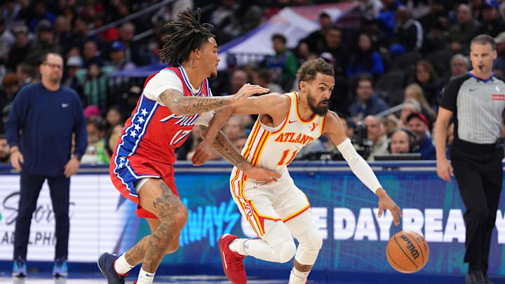 Apr 11, 2025; Philadelphia, Pennsylvania, USA; Atlanta Hawks guard Trae Young (11) drives against Philadelphia 76ers guard Jalen-Hood Schifino (17) in the first quarter at Wells Fargo Center. Mandatory Credit: Kyle Ross-Imagn Images