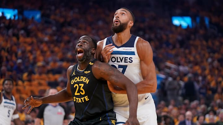 May 12, 2025; San Francisco, California, USA; Golden State Warriors forward Draymond Green (23) battles for position with Minnesota Timberwolves center Rudy Gobert (27) in the first quarter during game four of the second round for the 2025 NBA Playoffs at Chase Center. Mandatory Credit: Cary Edmondson-Imagn Images