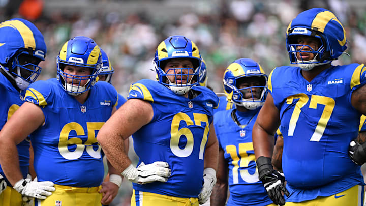 Sep 21, 2025; Philadelphia, Pennsylvania, USA; Los Angeles Rams center Coleman Shelton (65), offensive lineman Justin Dedich (67) and offensive tackle Alaric Jackson (77) against the Philadelphia Eagles at Lincoln Financial Field. Mandatory Credit: Eric Hartline-Imagn Images
