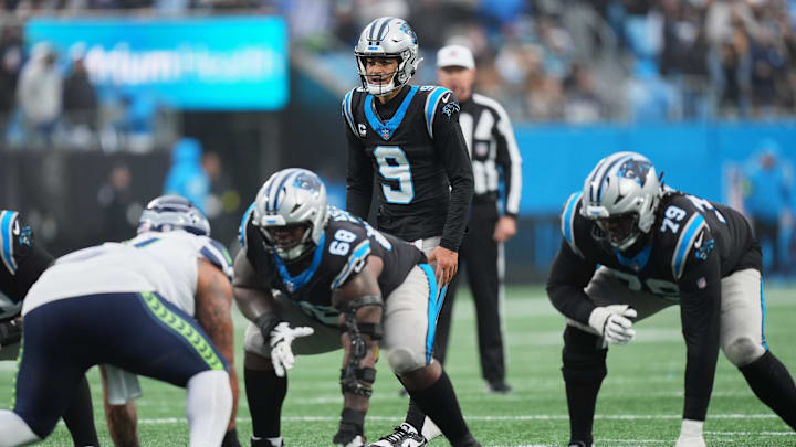 Dec 28, 2025; Charlotte, North Carolina, USA; Carolina Panthers quarterback Bryce Young (9) calls the snap count at the line of scrimmage against the Seattle Seahawks during the third quarter at Bank of America Stadium. Mandatory Credit: Jim Dedmon-Imagn Images