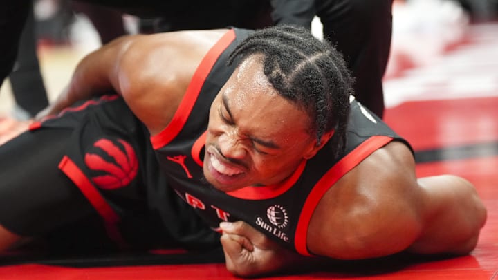 Feb 21, 2025; Toronto, Ontario, CAN; Toronto Raptors forward Scottie Barnes (4) lays on the court at a NBA game against the Miami Heat during the first half at Scotiabank Arena. Mandatory Credit: Kevin Sousa-Imagn Images
