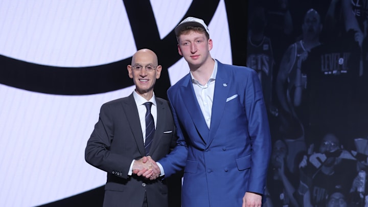 Jun 25, 2025; Brooklyn, NY, USA;  Danny Wolf stands with NBA commissioner Adam Silver after being selected as the 27th pick by the Brooklyn Nets in the first round of the 2025 NBA Draft at Barclays Center. Mandatory Credit: Brad Penner-Imagn Images