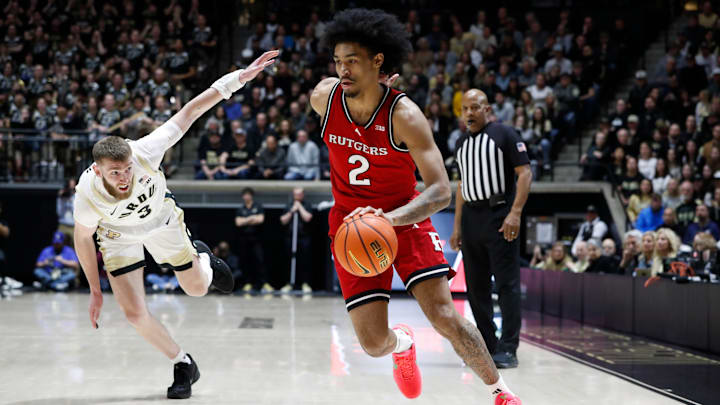Rutgers Scarlet Knights guard Dylan Harper (2) drives past Purdue Boilermakers guard Braden Smith (3) Tuesday, March 4, 2025, during the NCAA men’s basketball game at Mackey Arena in West Lafayette, Ind.