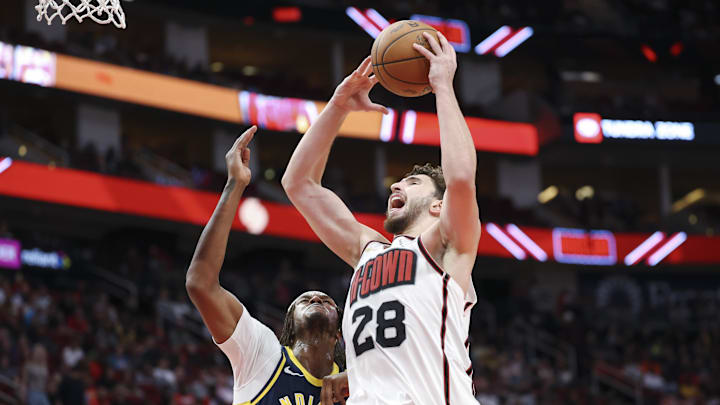 Nov 20, 2024; Houston, Texas, USA; Houston Rockets center Alperen Sengun (28) drives to the basket as Indiana Pacers center Myles Turner (33) defends during the second quarter at Toyota Center. Mandatory Credit: Troy Taormina-Imagn Images