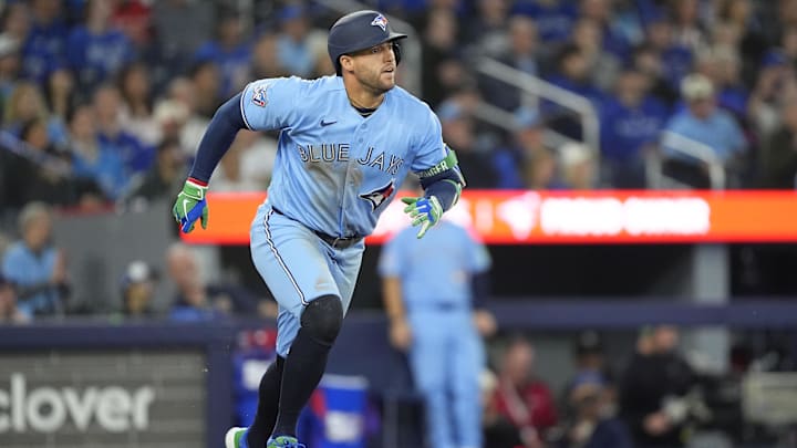 Apr 8, 2026; Toronto, Ontario, CAN; Toronto Blue Jays designated hitter George Springer (4) hits a one run double against the Los Angeles Dodgers during the seventh inning at Rogers Centre. Mandatory Credit: John E. Sokolowski-Imagn Images