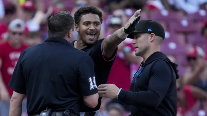 Jul 13, 2024; Cincinnati, Ohio, USA; Miami Marlins outfielder Dane Myers (54) is ejected after arguing with home plate umpire Derek Thomas in the eighth inning at Great American Ball Park. Mandatory Credit: The Cincinnati Enquirer-USA TODAY Sports