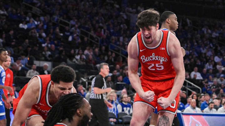 Dec 21, 2024; New York, New York, USA; Ohio State Buckeyes guard John Mobley Jr. (0), Ohio State Buckeyes guard Bruce Thornton (2) and Ohio State Buckeyes center Austin Parks (25) react during the first half against the Kentucky Wildcats at Madison Square Garden. Mandatory Credit: John Jones-Imagn Images