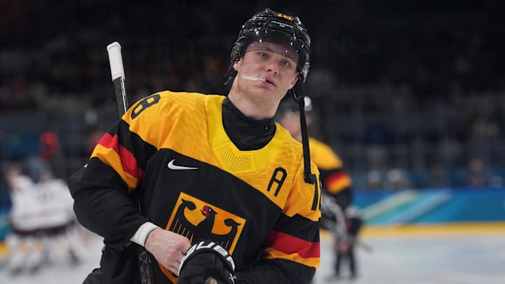Feb 14, 2026; Milan, Italy; Tim Stutzle of Germany at the start of the second period of a Group C men's ice hockey game during the Milano Cortina 2026 Olympic Winter Games at Milano Rho Ice Hockey Arena. Mandatory Credit: Amber Searls-Imagn Images