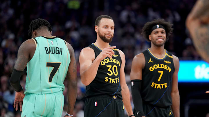 Feb 25, 2025; San Francisco, California, USA; Golden State Warriors guard Stephen Curry (30) and Buddy Hield (7) during a break in the third quarter against the Charlotte Hornets at the Chase Center. Mandatory Credit: Cary Edmondson-Imagn Images