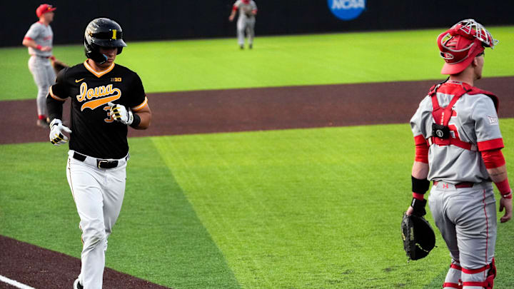 Iowa designated hitter Daniel Rogers (31) scores against Bradley April 16, 2025 at Duane Banks Field in Iowa City, Iowa.
