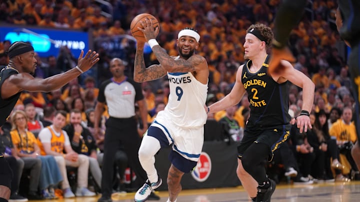May 12, 2025; San Francisco, California, USA; Minnesota Timberwolves guard Nickeil Alexander-Walker (9) drives past Golden State Warriors guard Brandin Podziemski (2) in the second quarter during game four of the second round for the 2025 NBA Playoffs at Chase Center. Mandatory Credit: Cary Edmondson-Imagn Images
