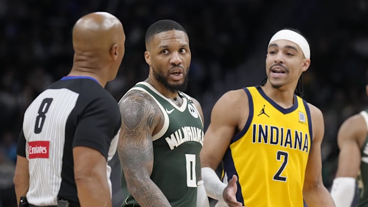 Apr 25, 2025; Milwaukee, Wisconsin, USA; Milwaukee Bucks guard Damian Lillard (0) and Indiana Pacers guard Andrew Nembhard (2) talk with referee Marc Davis during game three of first round for the 2024 NBA Playoffs at Fiserv Forum. Mandatory Credit: Michael McLoone-Imagn Images Apr 25, 2025; Milwaukee, Wisconsin, USA; Milwaukee Bucks guard Damian Lillard (0) and Indiana Pacers guard Andrew Nembhard (2) talk with referee Marc Davis during game three of first round for the 2024 NBA Playoffs at Fiserv Forum. Mandatory Credit: Michael McLoone-Imagn Images