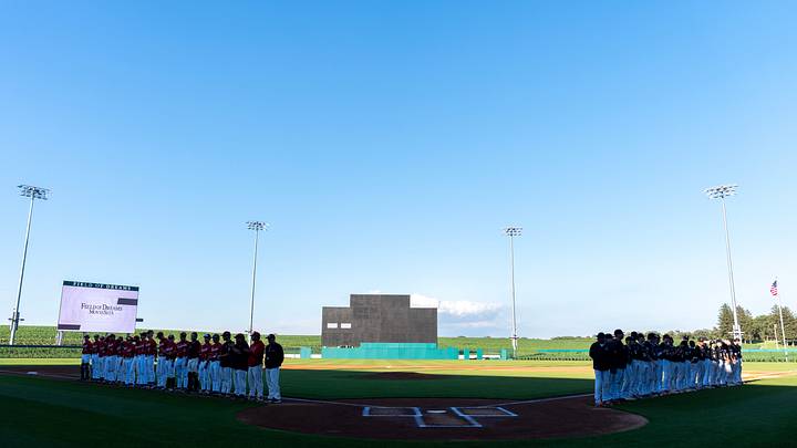 Western Dubuque and Clinton players and coaches take the field for roster introductions and the National Anthem June 17, 2026 at the Field of Dreams Ballpark in Dyersville, Iowa. Western Dubuque swept the JV/varsity doubleheader. Western Dubuque and Clinton players and coaches take the field for roster introductions and the National Anthem June 17, 2026 at the Field of Dreams Ballpark in Dyersville, Iowa. Western Dubuque swept the JV/varsity doubleheader.