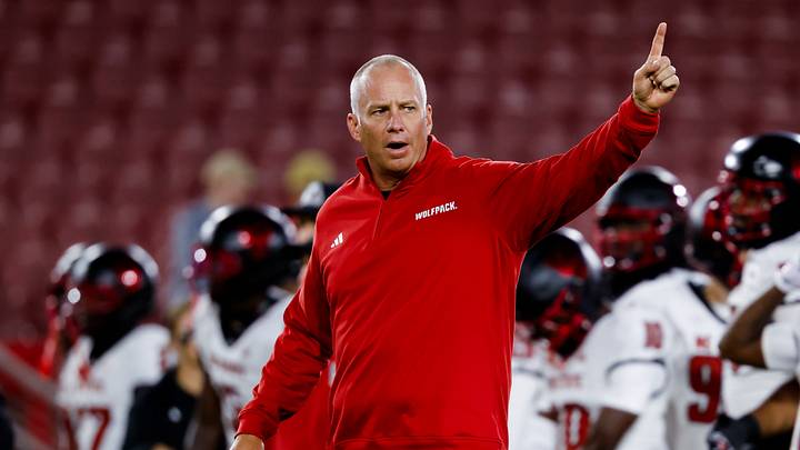 NC State Wolfpack head coach Dave Doeren instructs his players during warmups before the game against the Stanford Cardinal at Stanford Stadium. NC State Wolfpack head coach Dave Doeren instructs his players during warmups before the game against the Stanford Cardinal at Stanford Stadium.