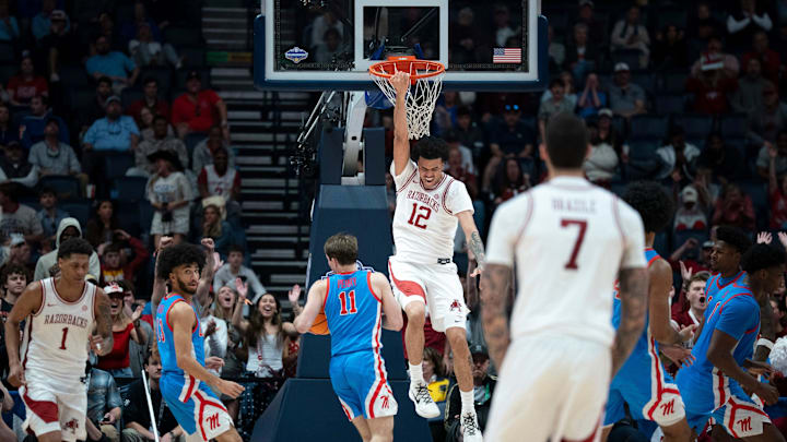 Arkansas forward Malique Ewin (12) finishes off a dunk against Mississippi during their semifinal game of the 2026 SEC Men’s Basketball Tournament at Bridgestone Arena in Nashville, Tenn., Saturday, March 14, 2026. Arkansas forward Malique Ewin (12) finishes off a dunk against Mississippi during their semifinal game of the 2026 SEC Men’s Basketball Tournament at Bridgestone Arena in Nashville, Tenn., Saturday, March 14, 2026.