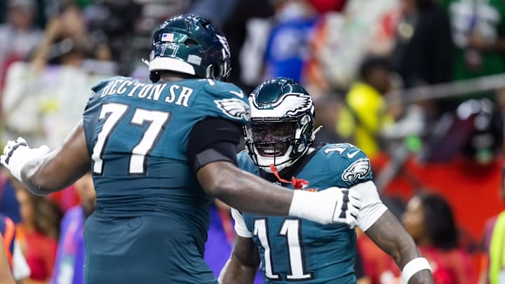 Feb 9, 2025; New Orleans, LA, USA; Philadelphia Eagles wide receiver A.J. Brown (11) celebrates a touchdown with offensive tackle Mekhi Becton (77) against the Kansas City Chiefs during Super Bowl LIX at Ceasars Superdome. Mandatory Credit: Mark J. Rebilas-Imagn Images