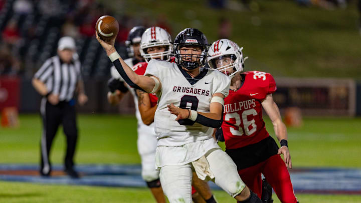 Buhler's # 8 Jeffrey Neill makes the pass for a first down.