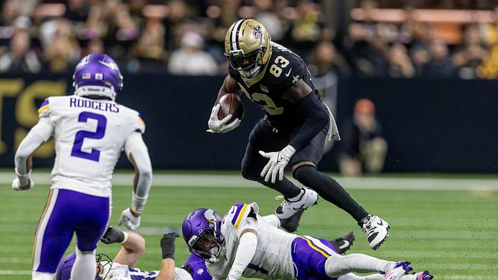 Oct 11, 2026; New Orleans, Louisiana, USA;  New Orleans Saints tight end Juwan Johnson (83) leaps over Minnesota Vikings outside linebacker Andrew van Ginkel (43) and cornerback Byron Murphy (7) during the second half at Caesars Superdome.  Mandatory Credit: Stephen Lew-Imagn Images