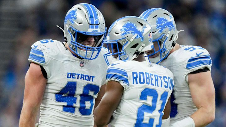 Detroit Lions linebacker Jack Campbell (46), Detroit Lions cornerback Amik Robertson (21) and Detroit Lions linebacker Trevor Nowaske (53) react after a play Sunday, Nov. 24, 2024, during a game against the Indianapolis Colts at Lucas Oil Stadium in Indianapolis.