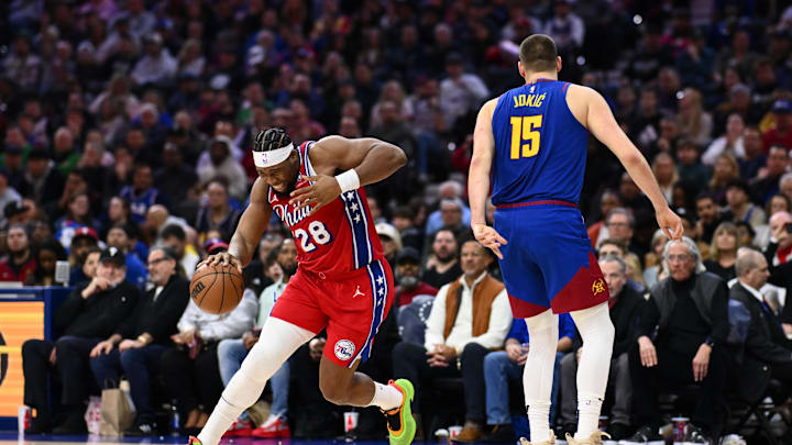 Jan 31, 2025; Philadelphia, Pennsylvania, USA; Philadelphia 76ers forward Guerschon Yabusele (28) reacts after colliding with Denver Nuggets center Nikola Jokic (15) in the third quarter at Wells Fargo Center. Mandatory Credit: Kyle Ross-Imagn Images