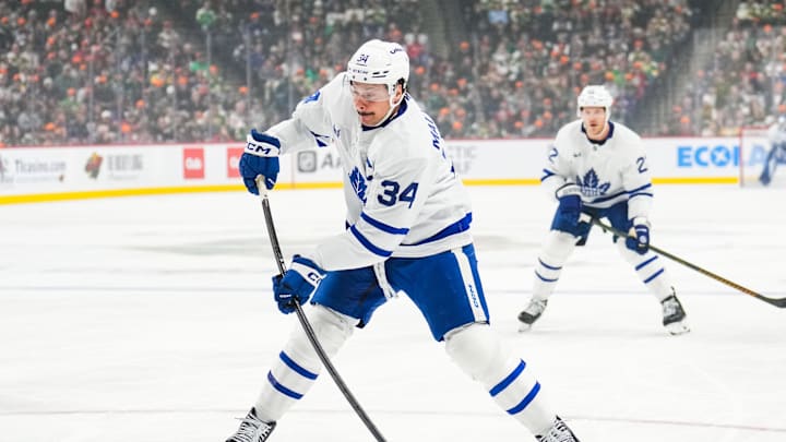 Nov 3, 2024; Saint Paul, Minnesota, USA; Toronto Maple Leafs center Auston Matthews (34) shoots during the first period against the Minnesota Wild at Xcel Energy Center. Mandatory Credit: Brace Hemmelgarn-Imagn Images