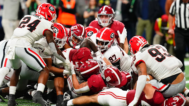Dec 2, 2023; Atlanta, GA, USA; Alabama Crimson Tide running back Roydell Williams (5) dives for a touchdown against the Georgia Bulldogs in the fourth quarter of the SEC Championship at Mercedes-Benz Stadium. Mandatory Credit: John David Mercer-Imagn Images