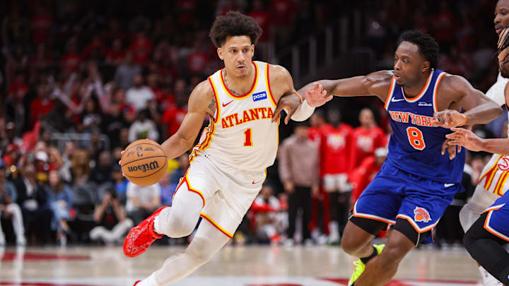 Apr 23, 2026; Atlanta, Georgia, USA; Atlanta Hawks forward Jalen Johnson (1) drives on New York Knicks forward Og Anunoby (8) in the fourth quarter during game three of the first round of the 2026 NBA Playoffs at State Farm Arena. Mandatory Credit: Brett Davis-Imagn Images