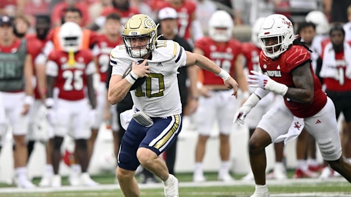 Sep 21, 2024; Louisville, Kentucky, USA;  Georgia Tech Yellow Jackets quarterback Haynes King (10) runs the ball against the Louisville Cardinals during the second half at L&N Federal Credit Union Stadium. Louisville defeated Georgia Tech 31-19. Mandatory Credit: Jamie Rhodes-Imagn Images