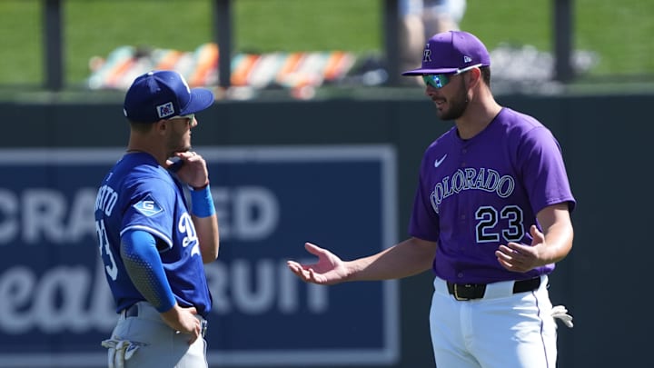 Feb 27, 2025; Salt River Pima-Maricopa, Arizona, USA; Los Angeles Dodgers outfielder Michael Conforto (23) and Colorado Rockies outfielder Kris Bryant (23) talk before a spring training game at Salt River Fields at Talking Stick. Mandatory Credit: Rick Scuteri-Imagn Images