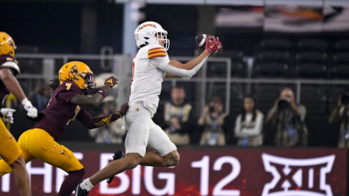 Dec 7, 2024; Arlington, TX, USA; Iowa State Cyclones wide receiver Jayden Higgins (9) and Arizona State Sun Devils defensive back Shamari Simmons (7) in action during the game between the Iowa State Cyclones and the Arizona State Sun Devils at AT&T Stadium. Mandatory Credit: Jerome Miron-Imagn Images