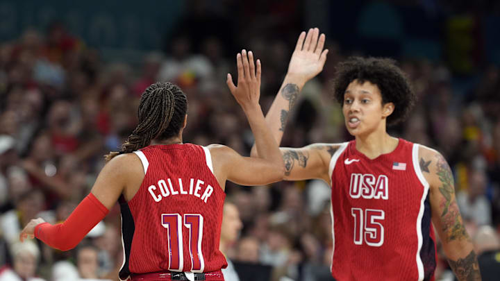Aug 1, 2024; Villeneuve-d'Ascq, France; United States small forward Napheesa Collier (11) celebrates with centre Brittney Griner (15) after scoring against Belgium in the second half in a women’s group stage game during the Paris 2024 Olympic Summer Games at Stade Pierre-Mauroy. Mandatory Credit: John David Mercer-USA TODAY Sports