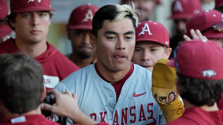 Arkansas infielder Wehiwa Aloy (9) celebrates after scoring a run during a NCAA baseball game against Georgia in Athens, Ga., on Friday, April 11, 2025.