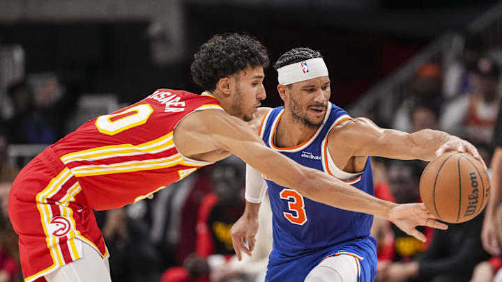 Nov 6, 2024; Atlanta, Georgia, USA; Atlanta Hawks forward Zaccharie Risacher (10) defends against New York Knicks guard Josh Hart (3) during the second half at State Farm Arena. Mandatory Credit: Dale Zanine-Imagn Images