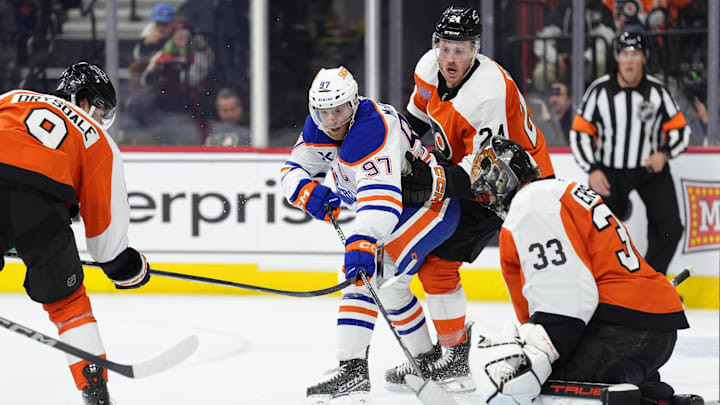 Feb 22, 2025; Philadelphia, Pennsylvania, USA; Edmonton Oilers center Connor McDavid (97) shoots the puck against Philadelphia Flyers defenseman Nick Seeler (24) in the second period at Wells Fargo Center. Mandatory Credit: Kyle Ross-Imagn Images